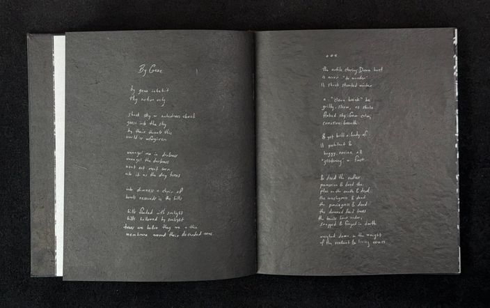 Spread with By Gaze handwritten in silver ink