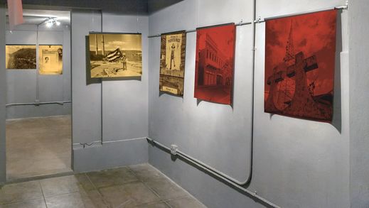 Gallery corner with gold and red silk prints